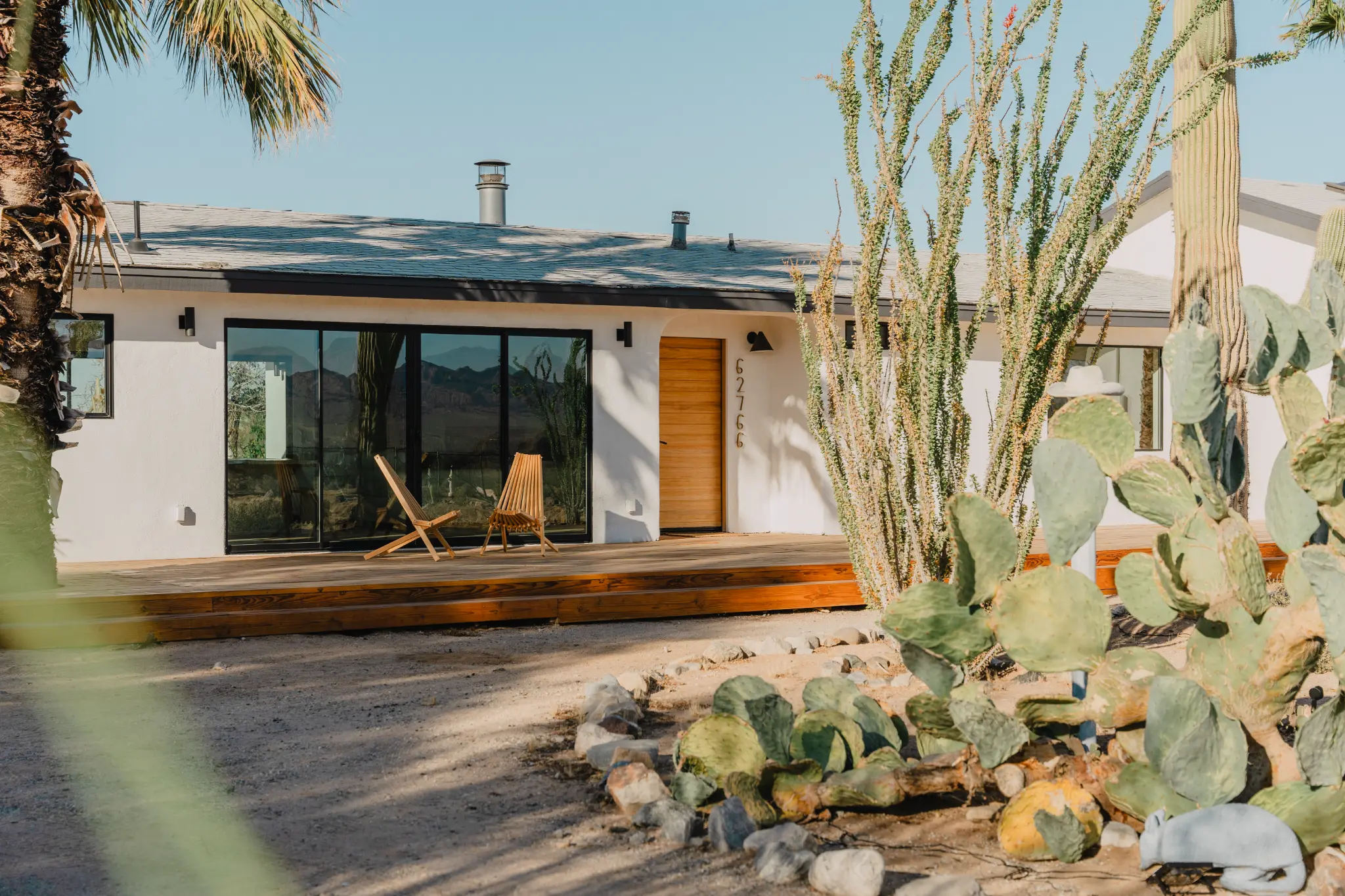 Exterior facade with saguaro cactus and blue sky